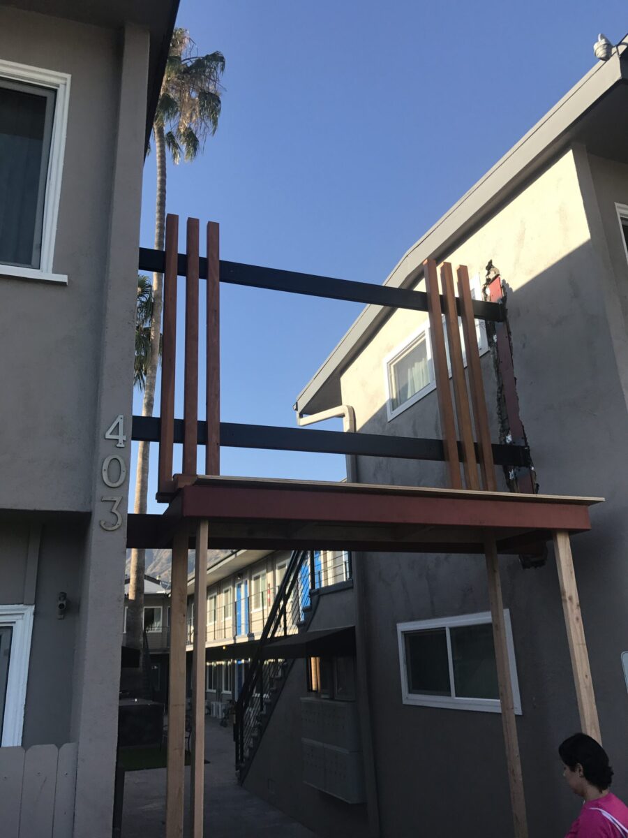 Newly built wooden balcony under construction on a modern building. Newly built wooden balcony under construction on a modern building.