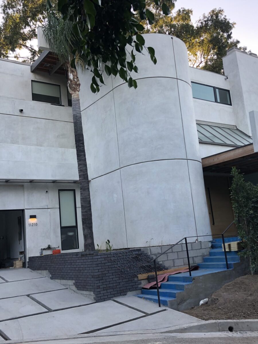 Modern white house with curved architecture and garage. Modern white house with curved architecture and garage.