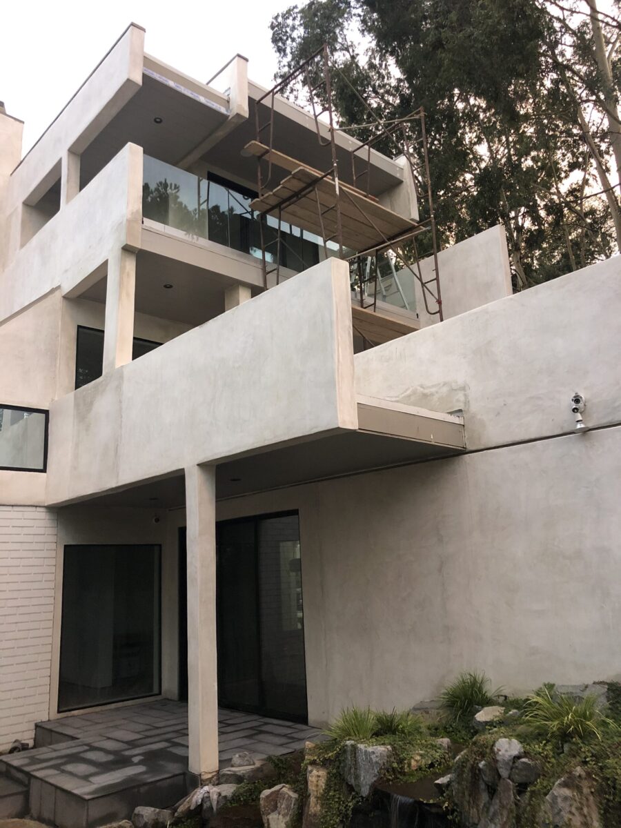 Modern concrete building with balconies and geometric design. Modern concrete building with balconies and geometric design.