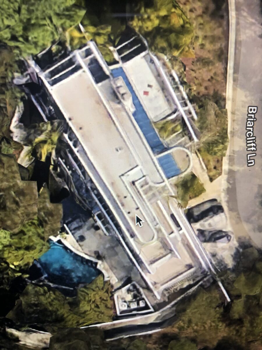 A large, modern house with a pool and surrounding greenery. A large, modern house with a pool and surrounding greenery.